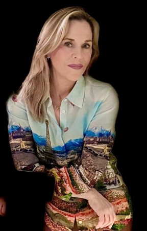a woman with long blond hair wearing a multi coloured shirt